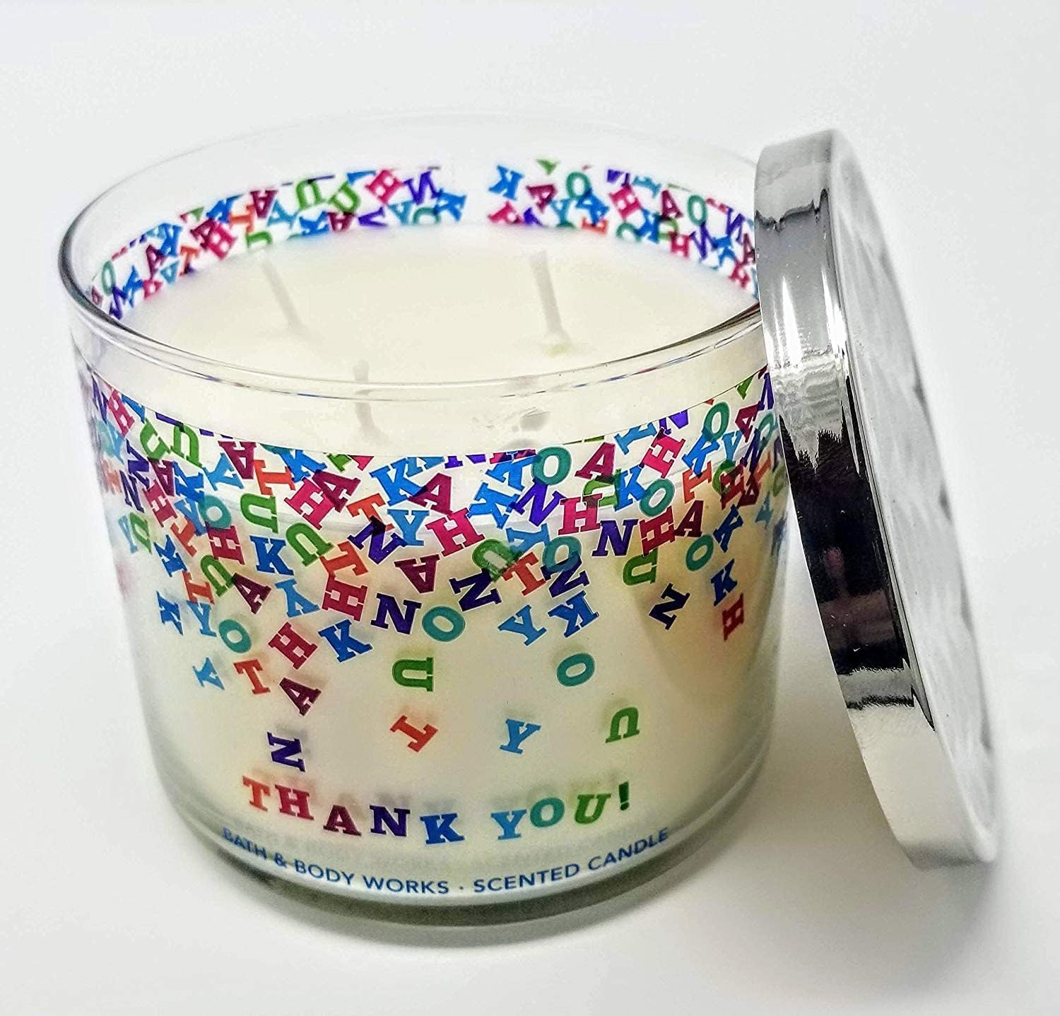 Closeup of Champagne Toast label on 3-Wick candle showing festive scent notes