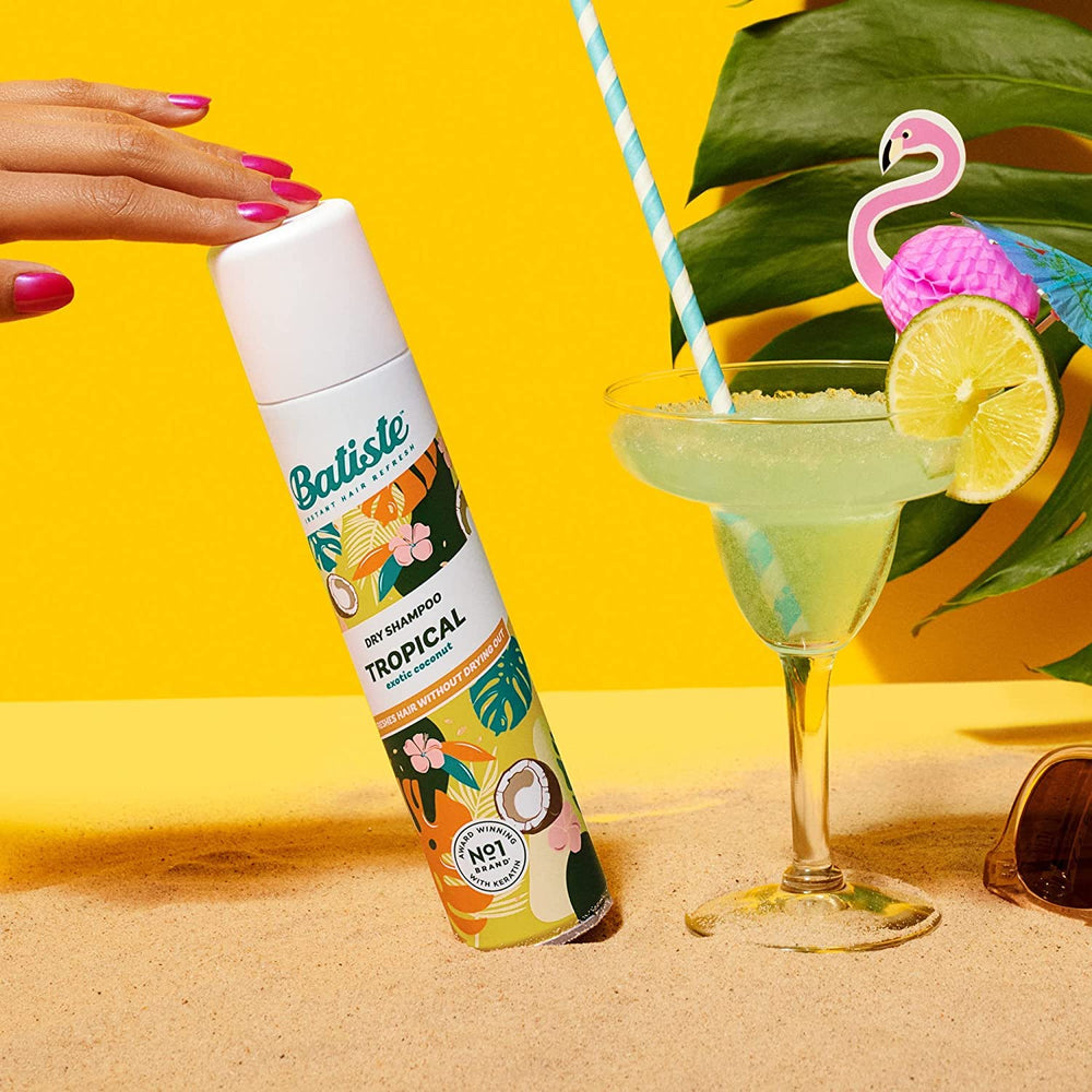 Batiste Tropical Dry Shampoo in-use photo showing quick 12-inch spray technique.