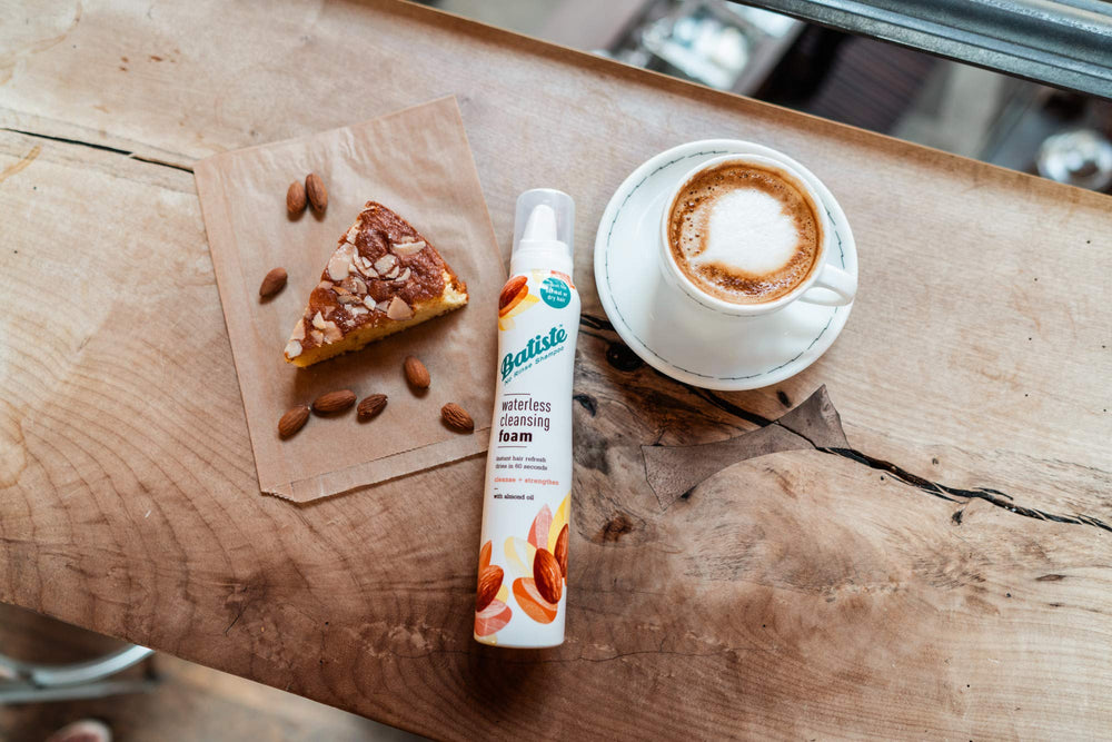 Batiste cleansing foam in bathroom scene suggests convenient on-the-go refresh