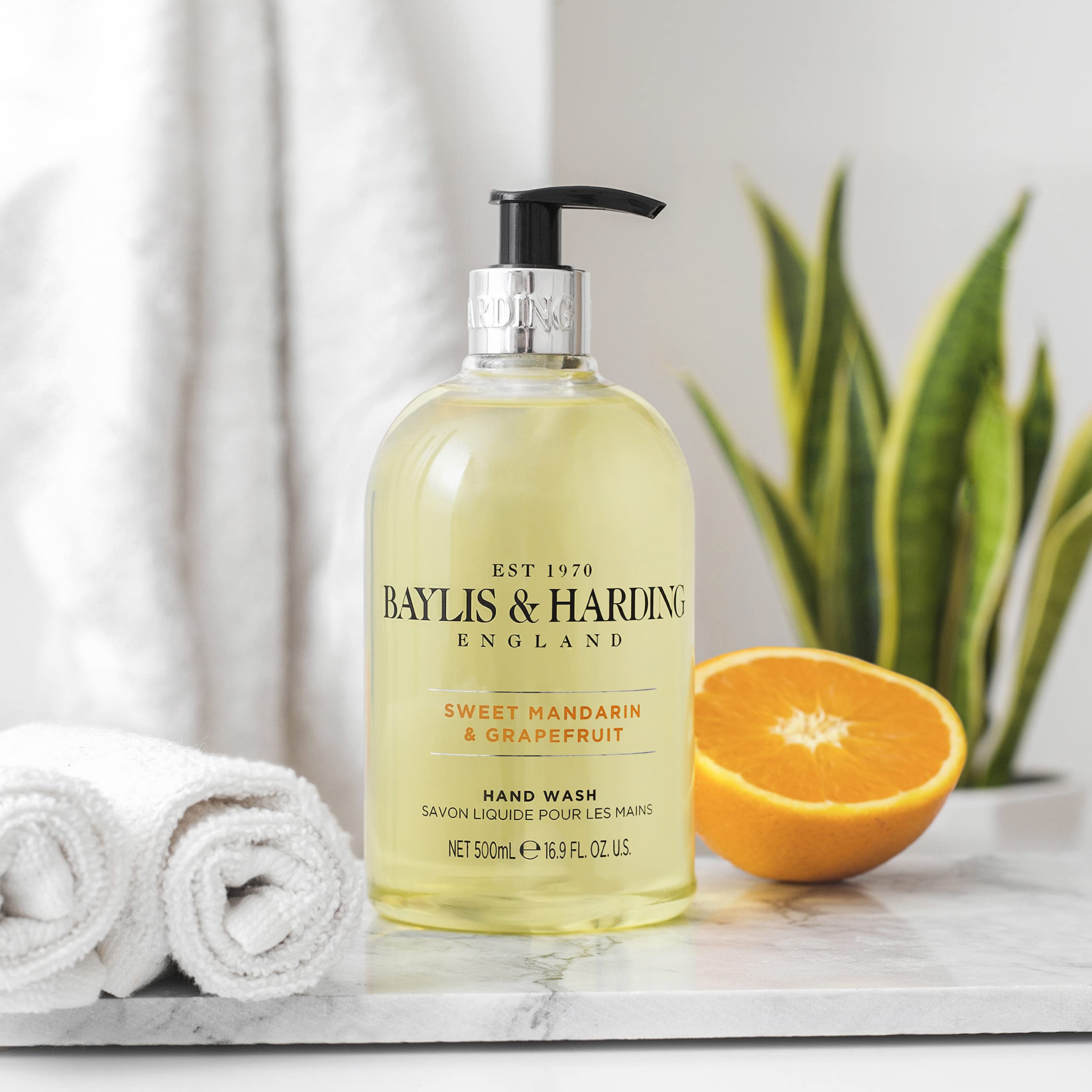 Luxurious Baylis & Harding hand wash at sink suitable for kitchen or bathroom tasks.