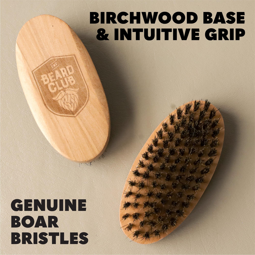 The Beard Club brush in hand on dresser demonstrates easy daily styling.