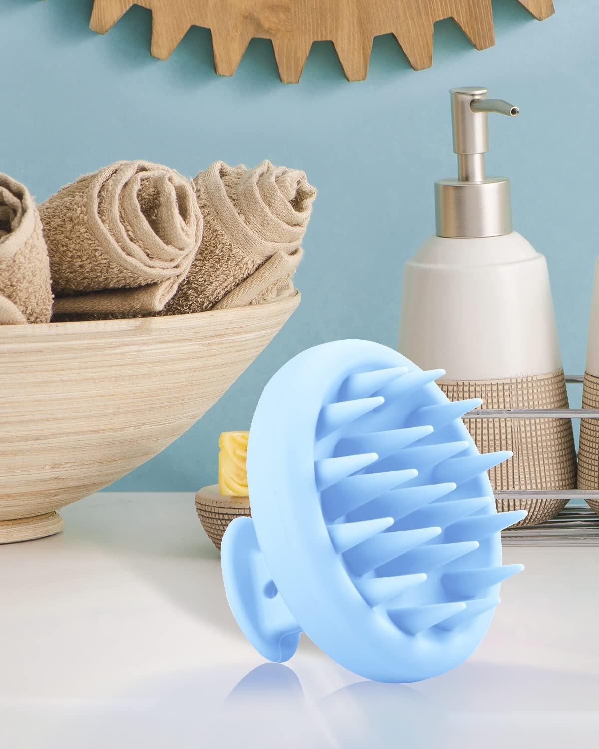 Beautlohas blue silicone bristles replace finger massage for gentler scalp care.