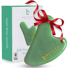 Beauty by Earth Jade Gua Sha face sculpting tool for jawline contour and facial tension relief.