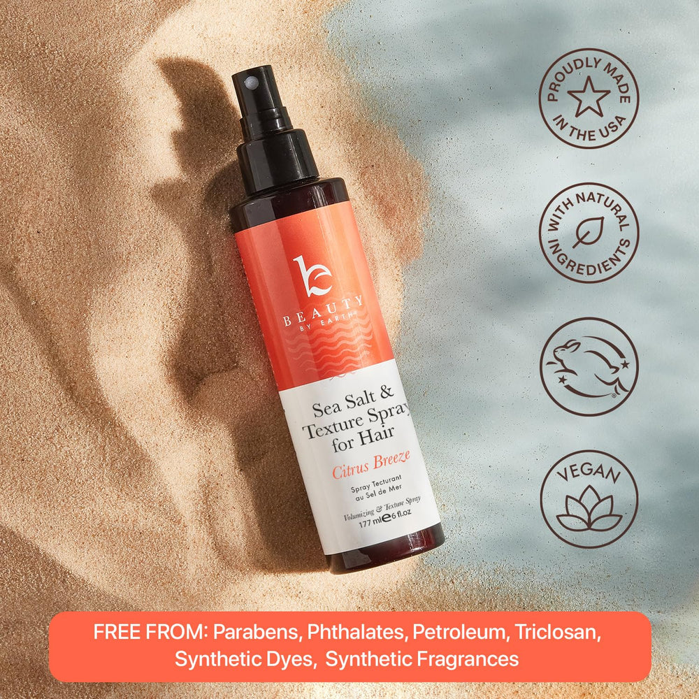 Model demonstrates easy styling with Beauty by Earth sea salt spray for men.