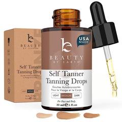 Beauty by Earth self tanning drops bottle closeup showcasing natural, streak-free color.