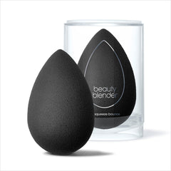 Beautyblender Pro damp sponge closeup reveals aqua-activated swelling for smooth application.