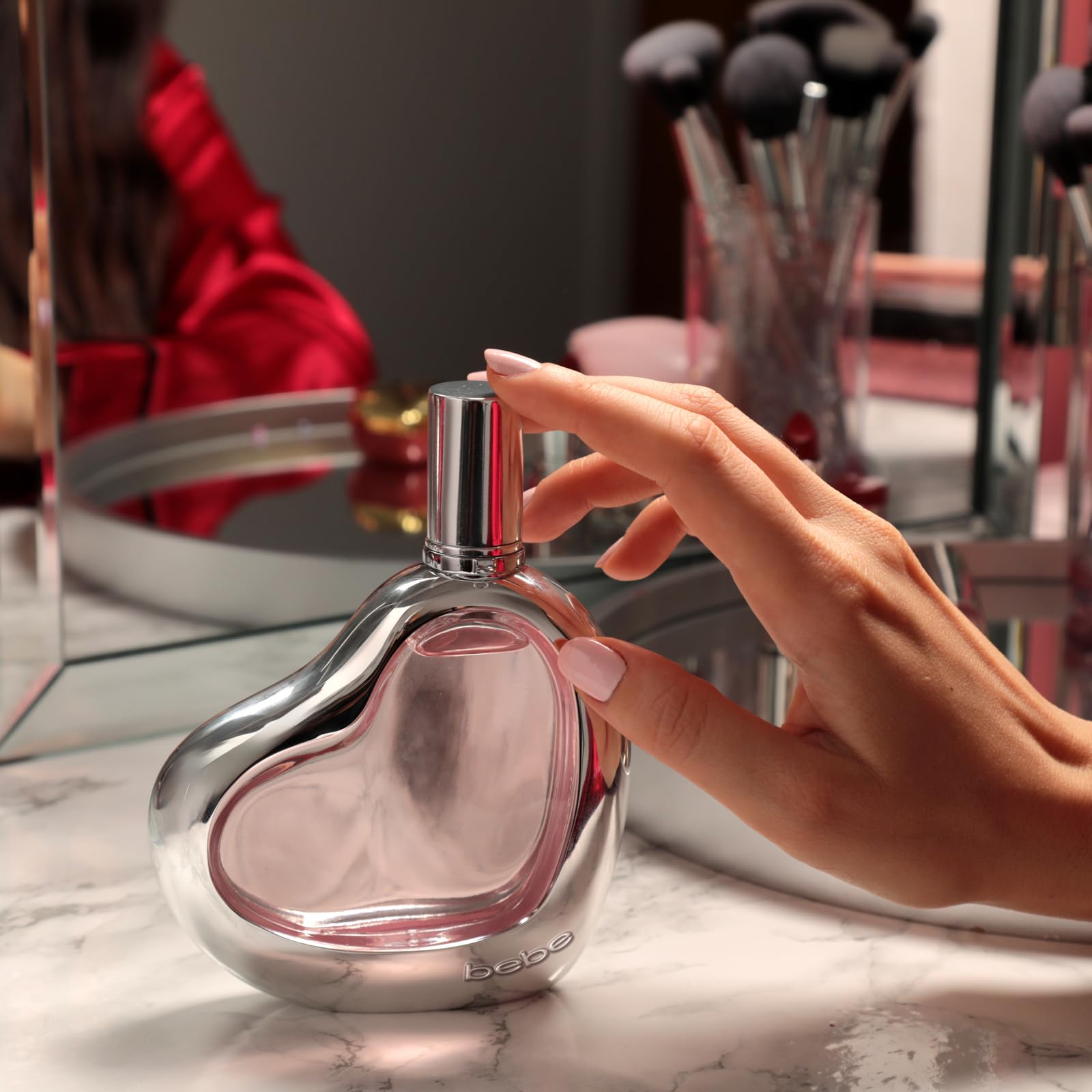 Bebe EDP mist release — soft amber glow and warm scent profile.