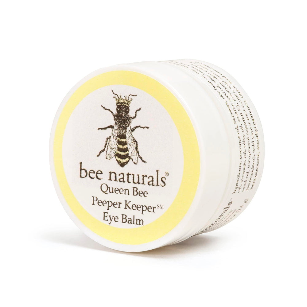 Queen Bee Best Eye Balm packaging shot featuring multi-oil blend for nourishing skin.