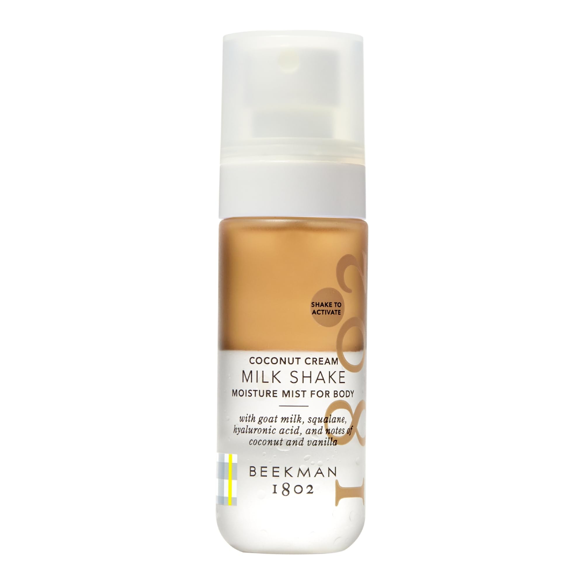 Beekman 1802 Milk Shake Body Mist coconut cream bottle provides light hydration for sensitive skin.