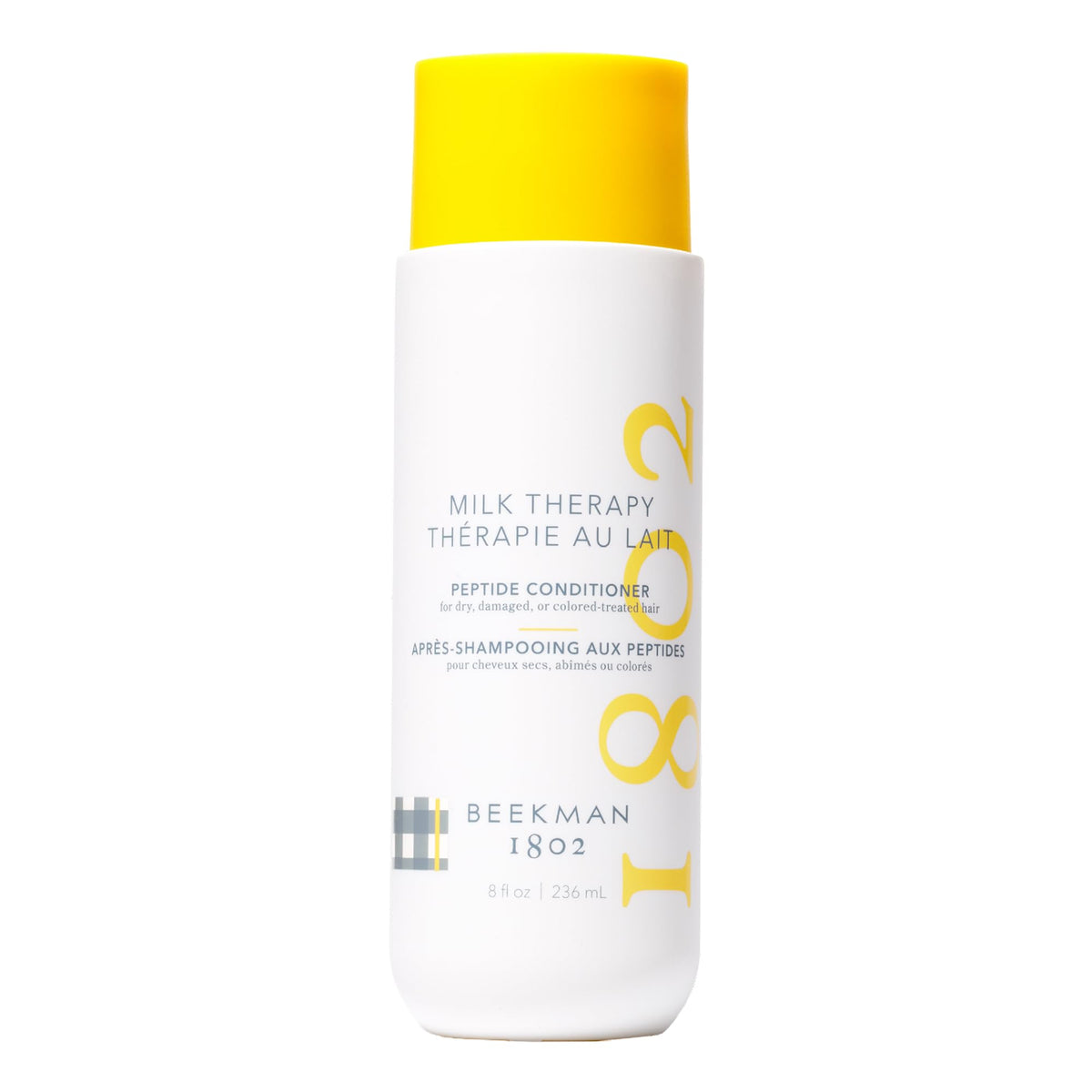 Beekman 1802 Milk Therapy Peptide Conditioner bottle pour for smooth, nourishing application