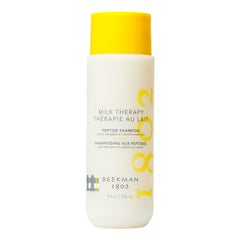 Beekman 1802 Milk Therapy Peptide Shampoo bottle closeup highlighting gentle cleansing and goat-milk nourishment.
