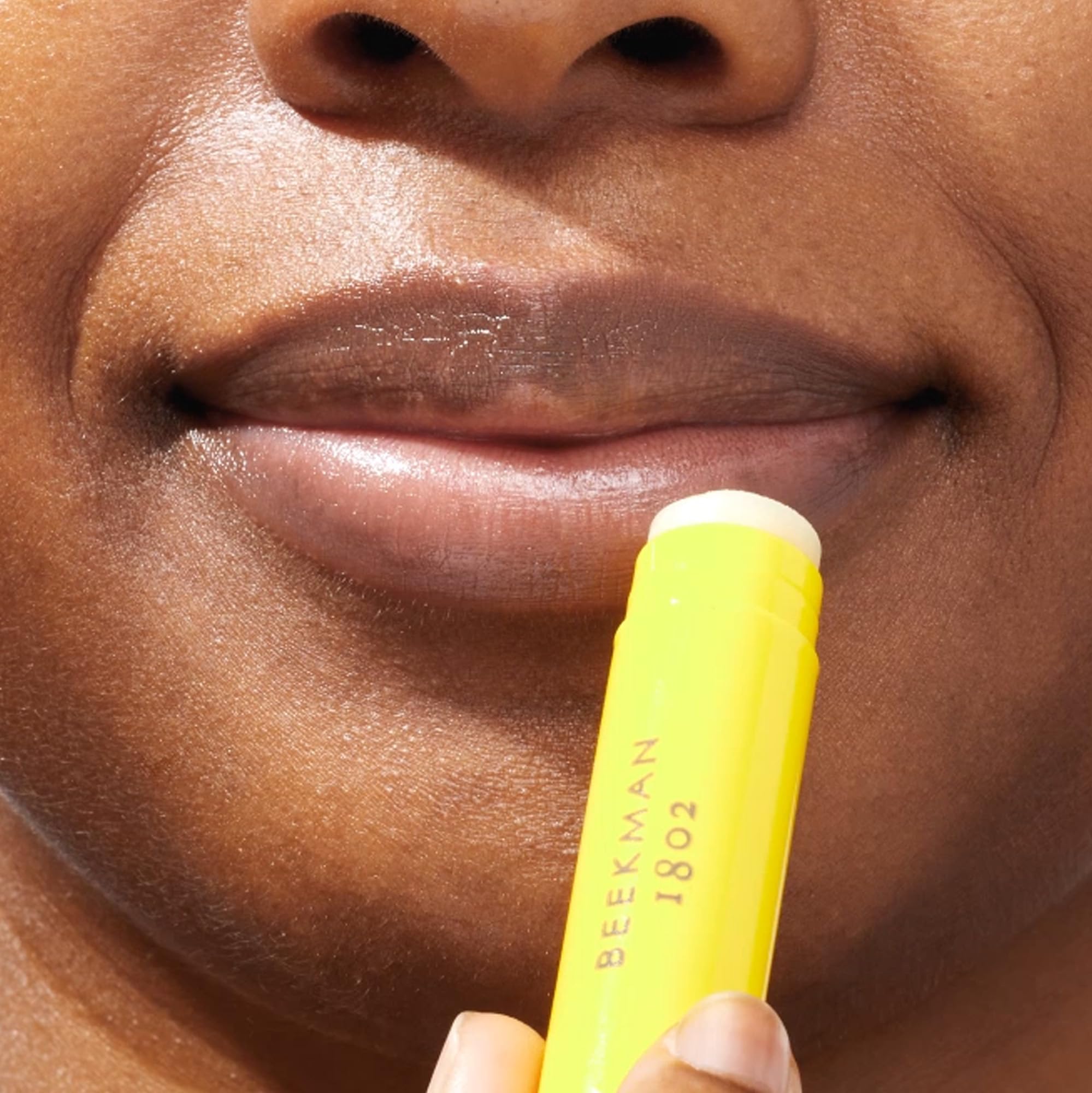 Beekman 1802 Lilac Dream Lip Balm lip swatch showing soft, moisturized lips.