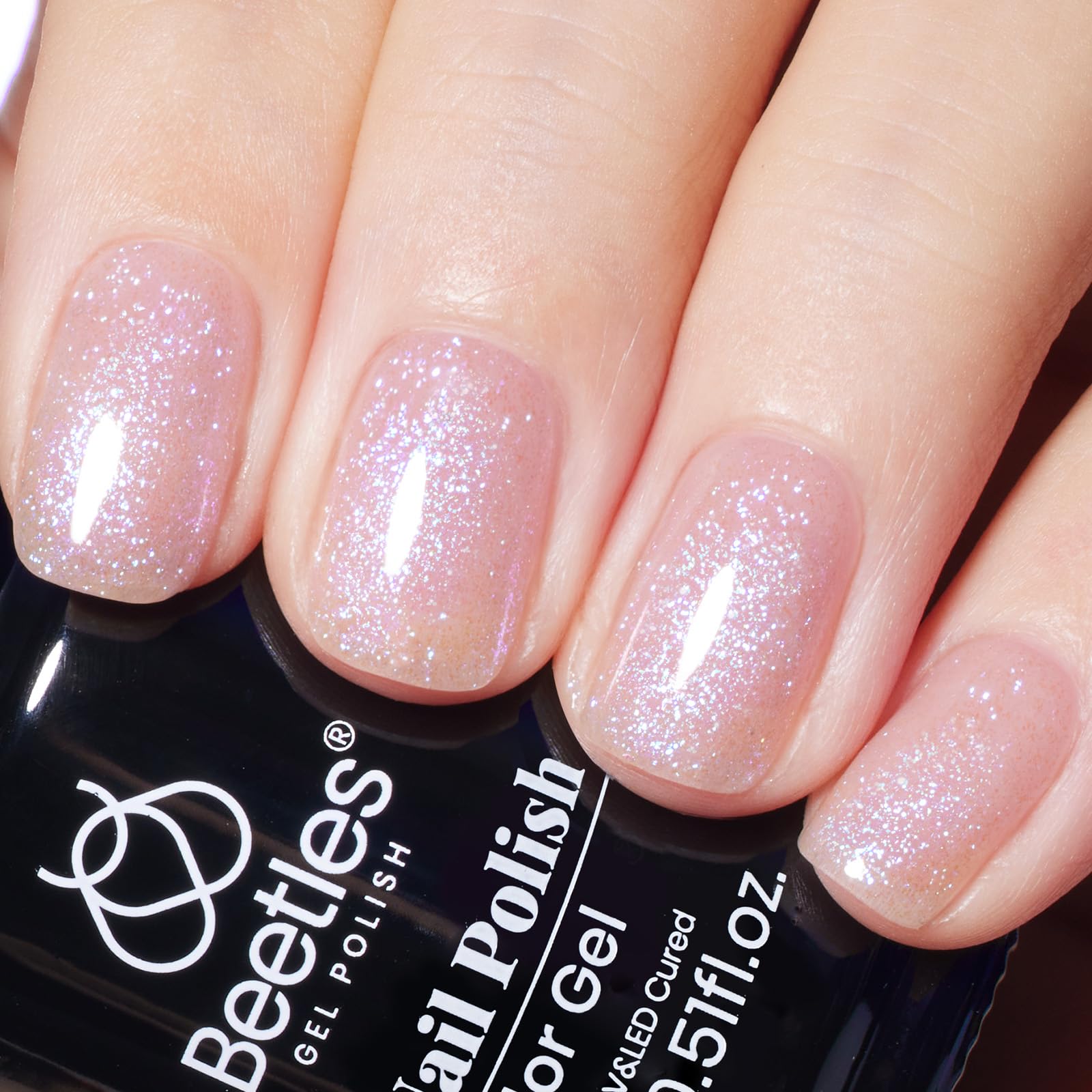 Beetles Gel Polish Purple Jelly bottle shows shimmering color and potential for radiant nails.
