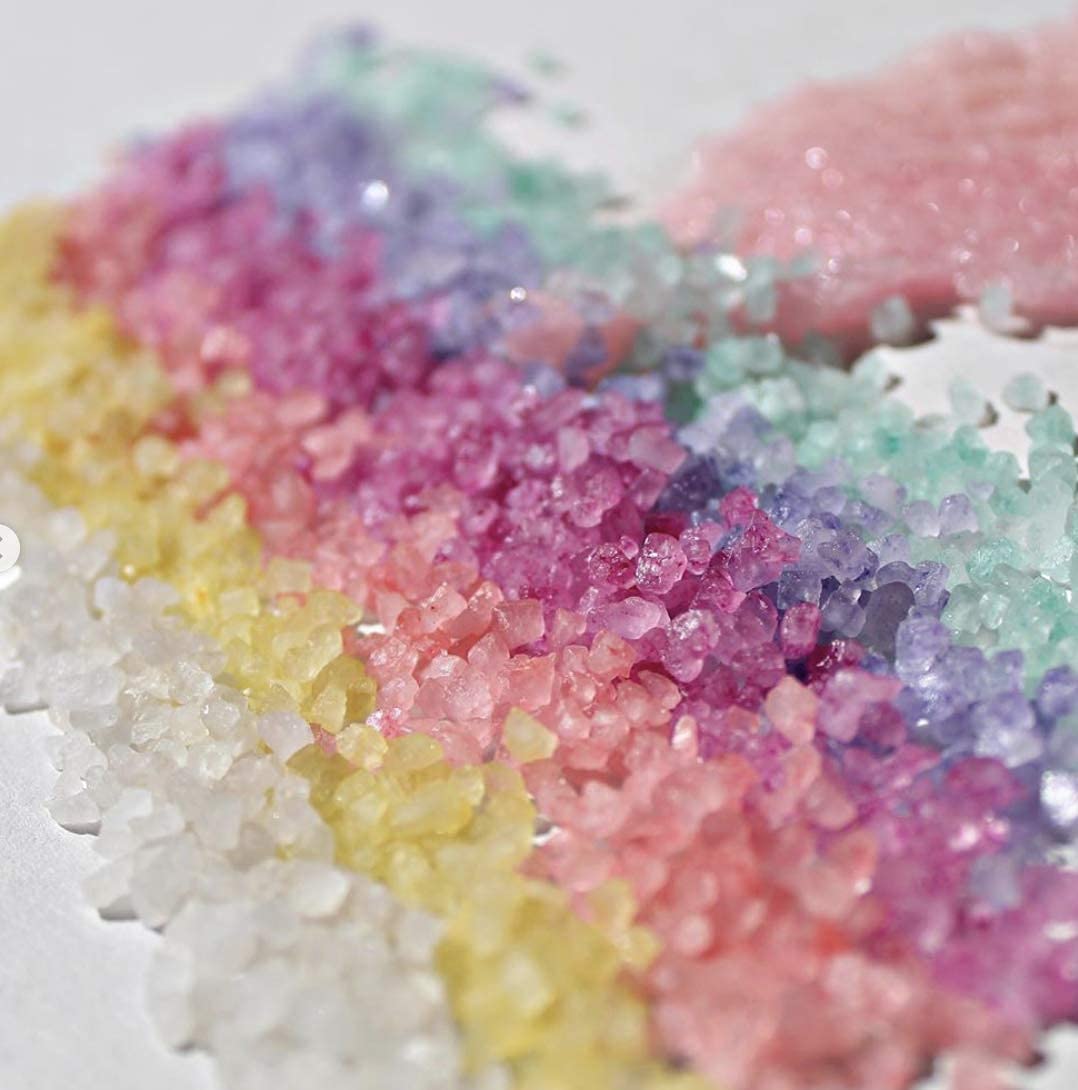 Closeup of Paradise Fruits bath salts crystals showing color and aroma notes.
