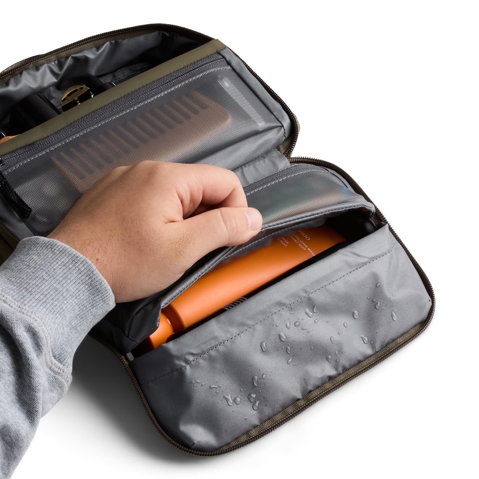Bellroy Hanging Toiletry Kit SeaKelp toothbrush pocket keeps brushes tidy during travel.