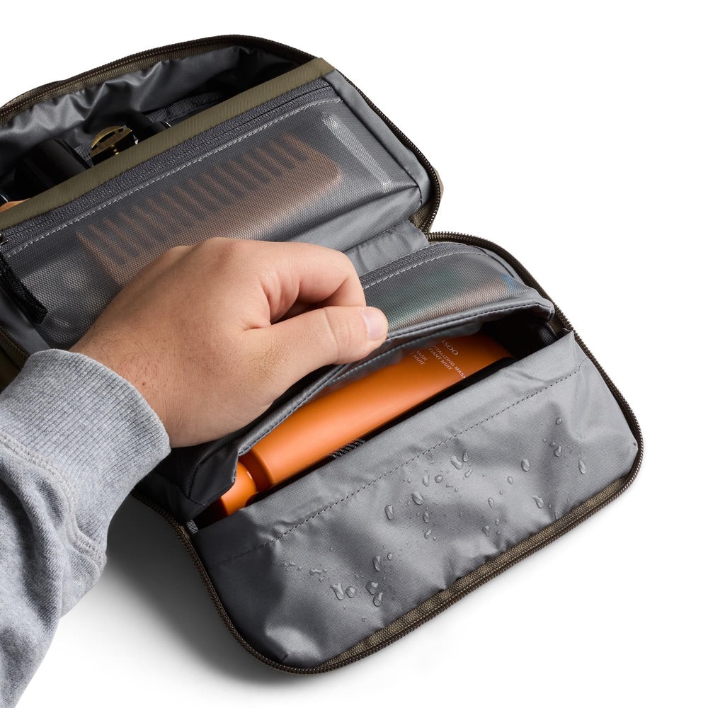 Bellroy Hanging Toiletry Kit SeaKelp toothbrush pocket keeps brushes tidy during travel.