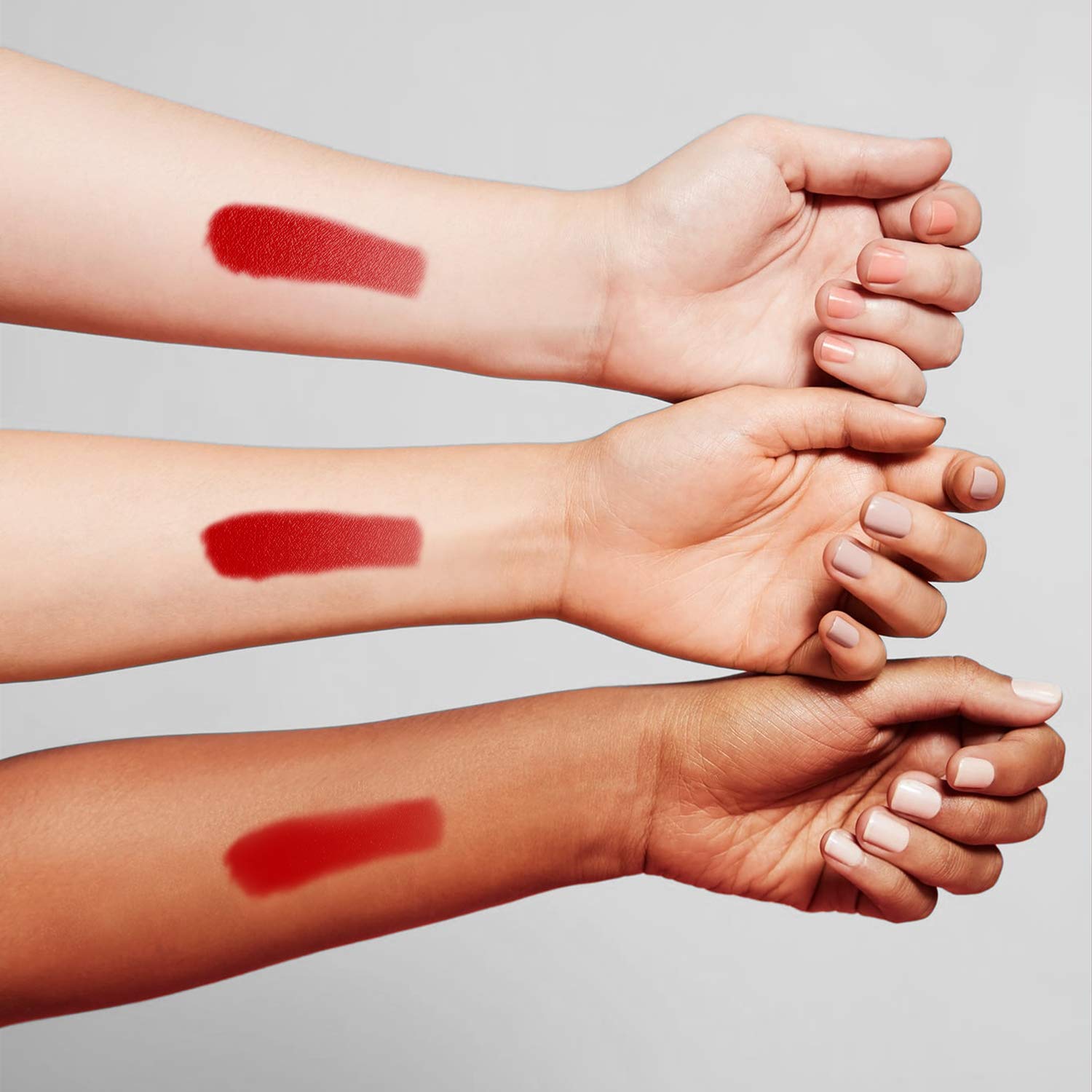 Benefit Benetint cheek swatch reveals sheer rose tint for versatility.