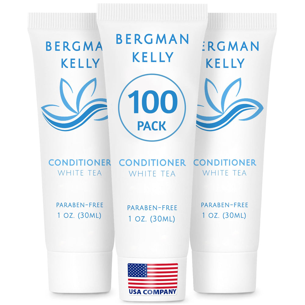 BERGMAN KELLY hotel conditioner white tea bottle on guest room vanity for a refreshing stay.