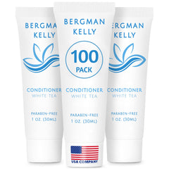 BERGMAN KELLY hotel conditioner white tea bottle on guest room vanity for a refreshing stay.