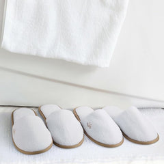 BERGMAN KELLY spa slippers gray flecked trim suited for lounge and hotel ambiance.