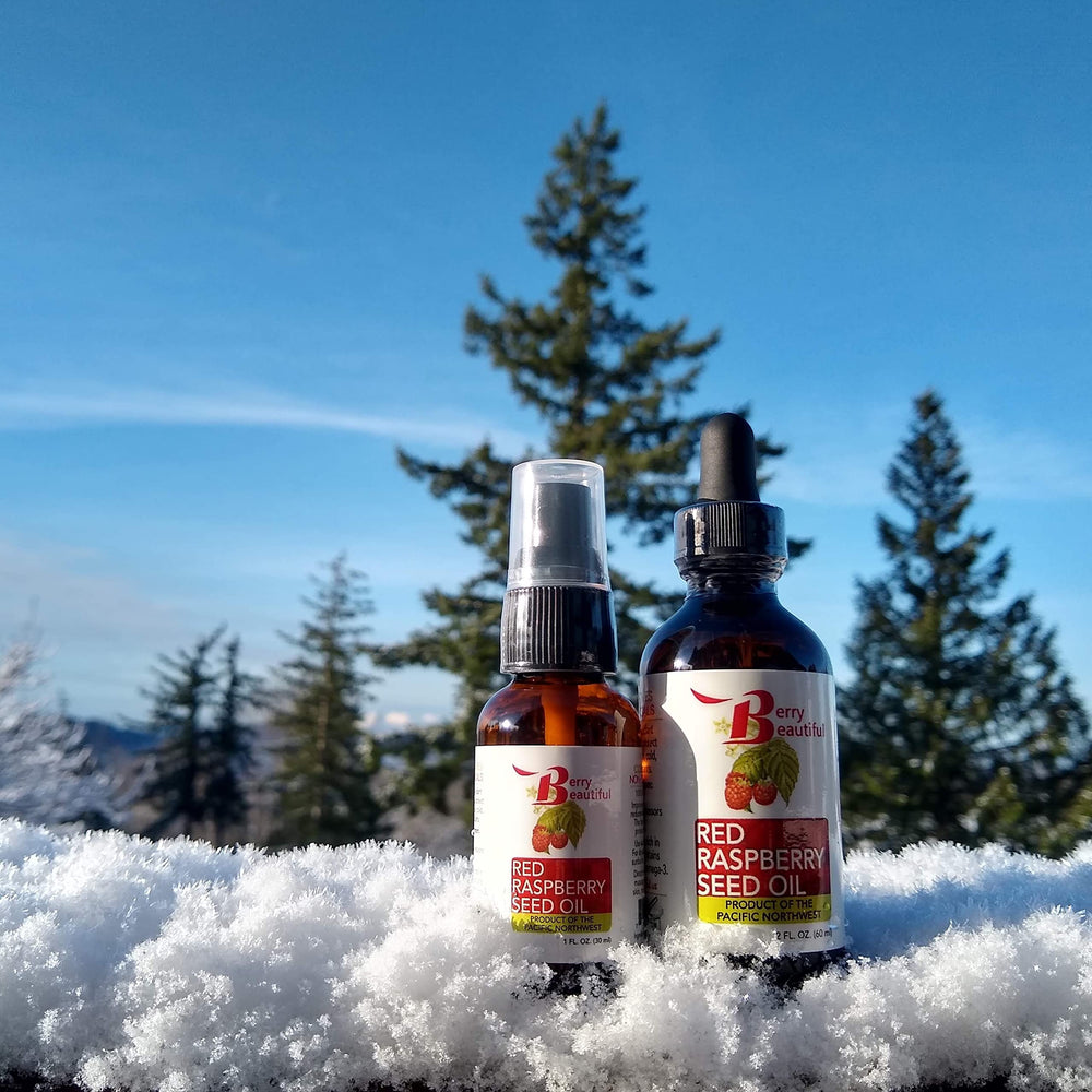 Berry Beautiful Raspberry Seed Oil amber flask captures premium unrefined color and aroma.