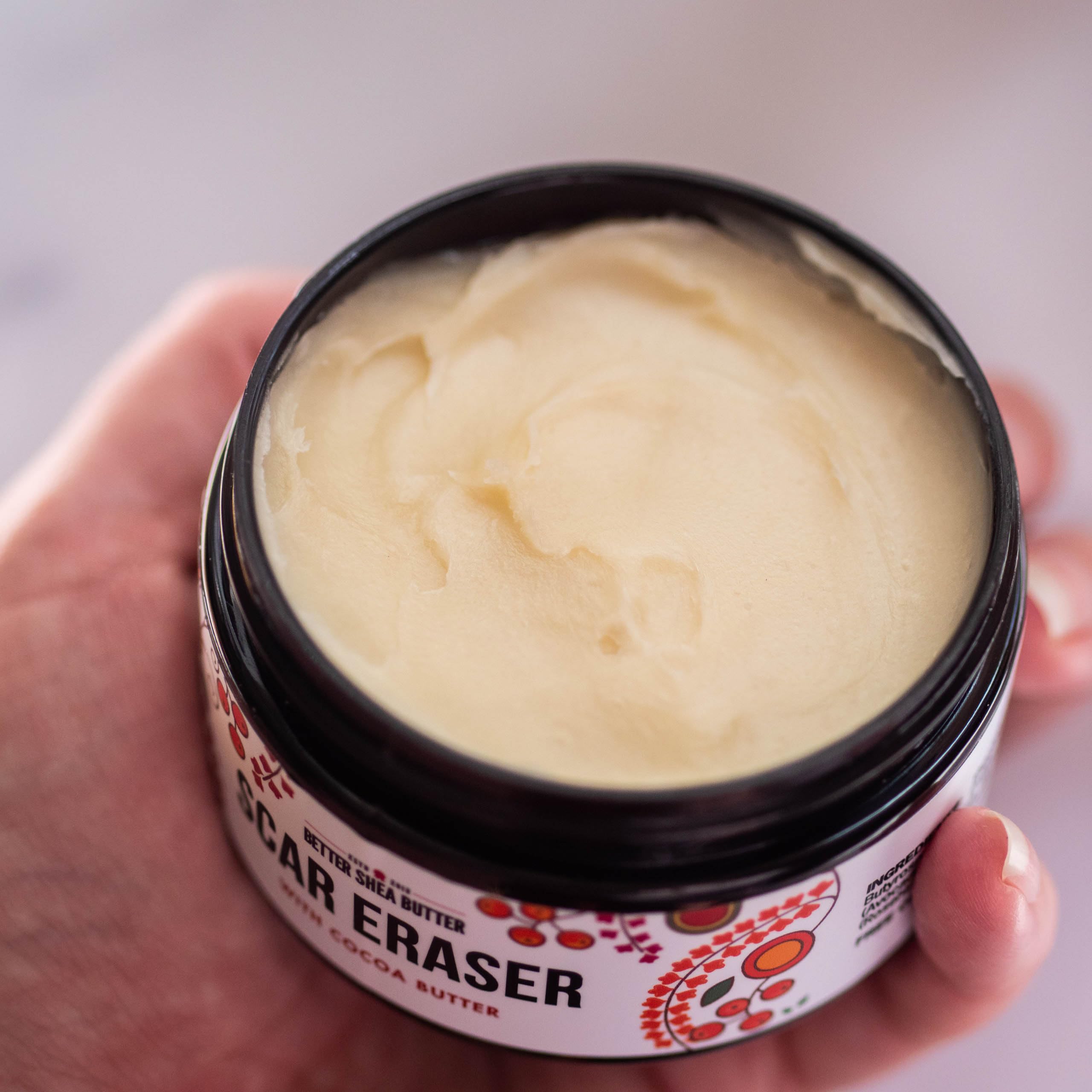 Better Shea Butter Scar Eraser Balm spread on skin demonstrating deep hydration for dry areas