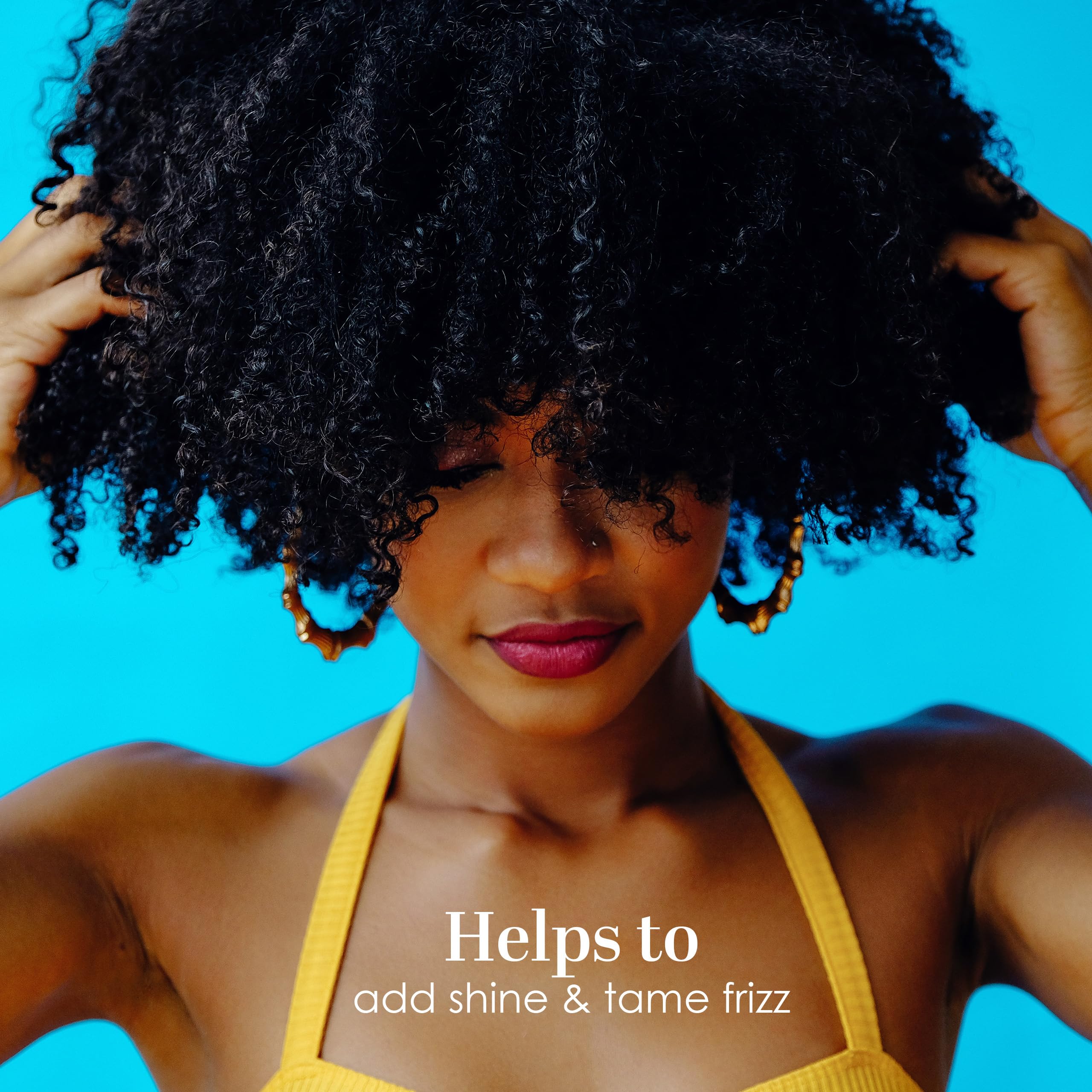 Hands apply Better Shea Butter on skin, showcasing smooth absorption