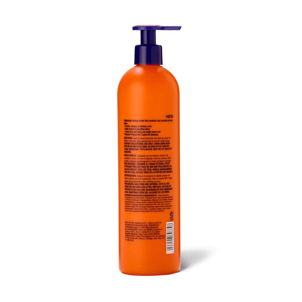 Beyond the Zone curling creme hands scrunching damp hair for curl definition.