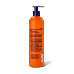Beyond the Zone curling creme hands scrunching damp hair for curl definition.
