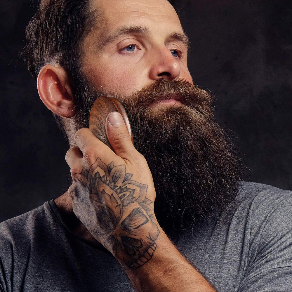 BFWood beard brush in use demonstrates even distribution and detangling-friendly bristles.