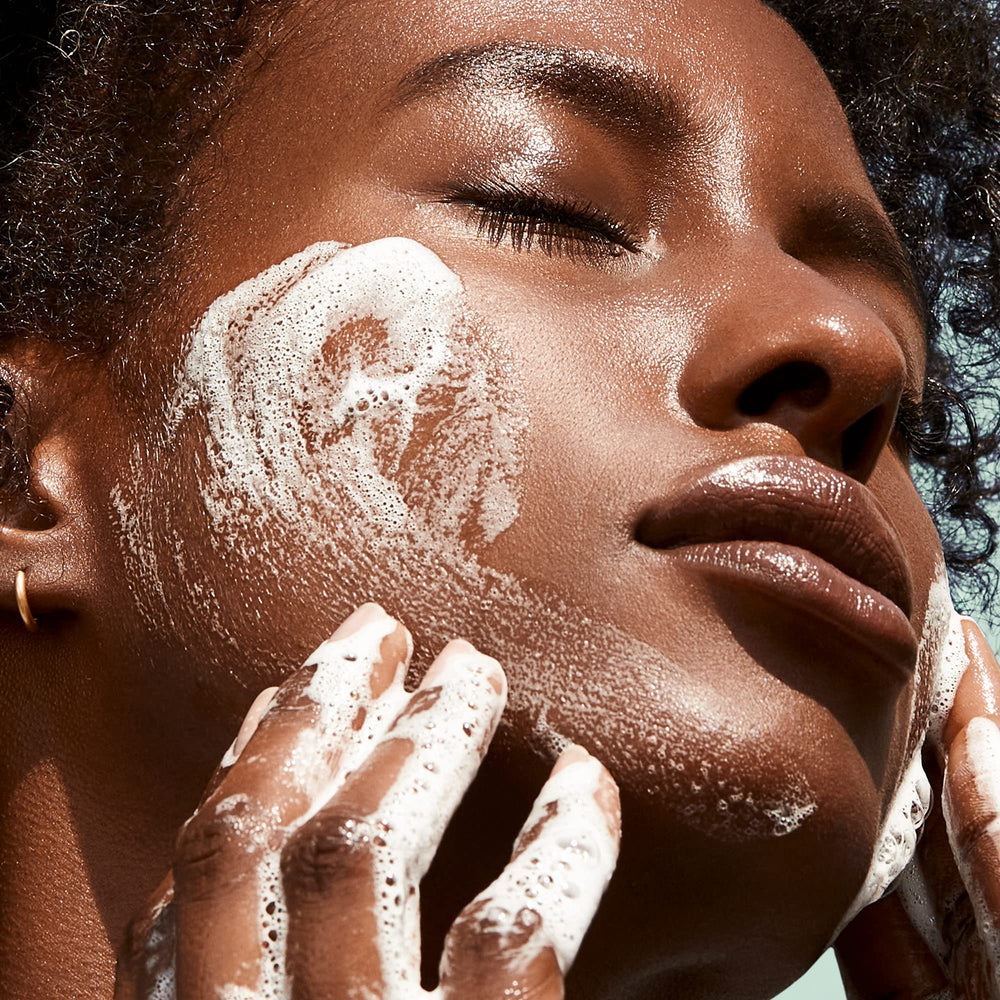 BIOSSANCE wash on a porcelain skin surface showing refreshed texture.
