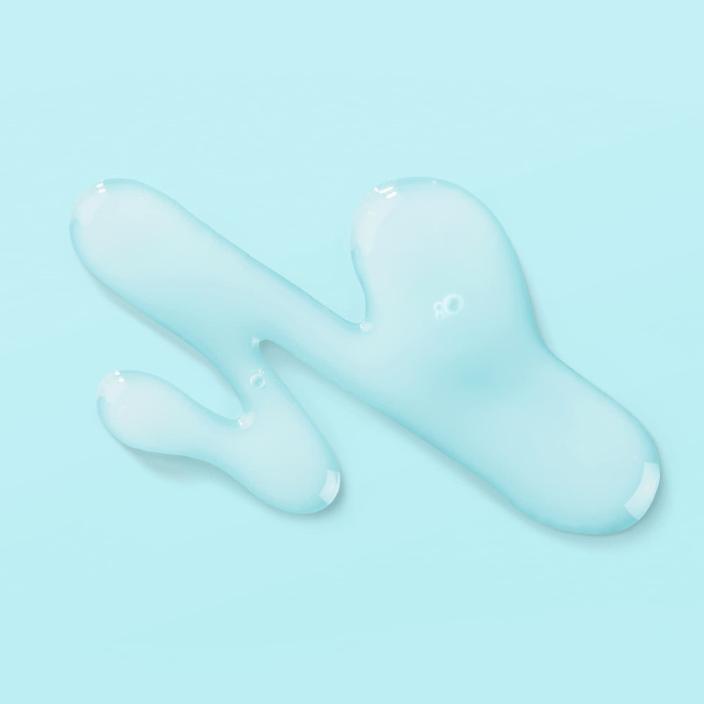 Glass Biossance bottle shown on skin with a dewy, healthy glow.