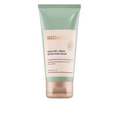 BIOSSANCE Squalane + Omega hand cream tube application showing immediate moisture.