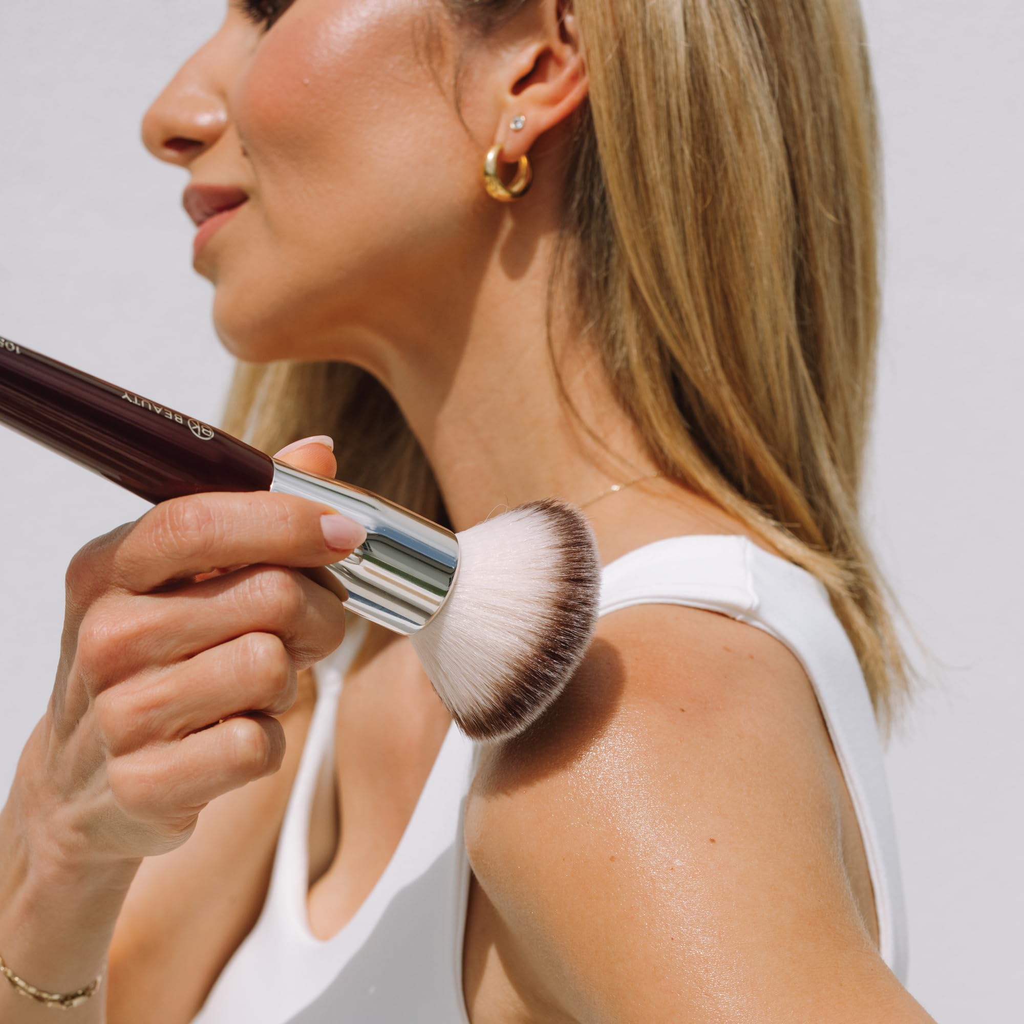 BK BEAUTY multi-use brushes shown with bronzer, blush, and powder