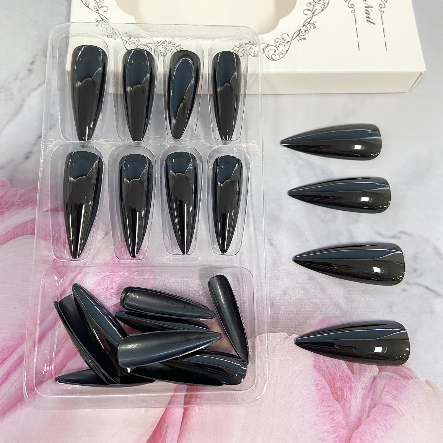 Black Solid Color Stiletto nails glossy finish close-up