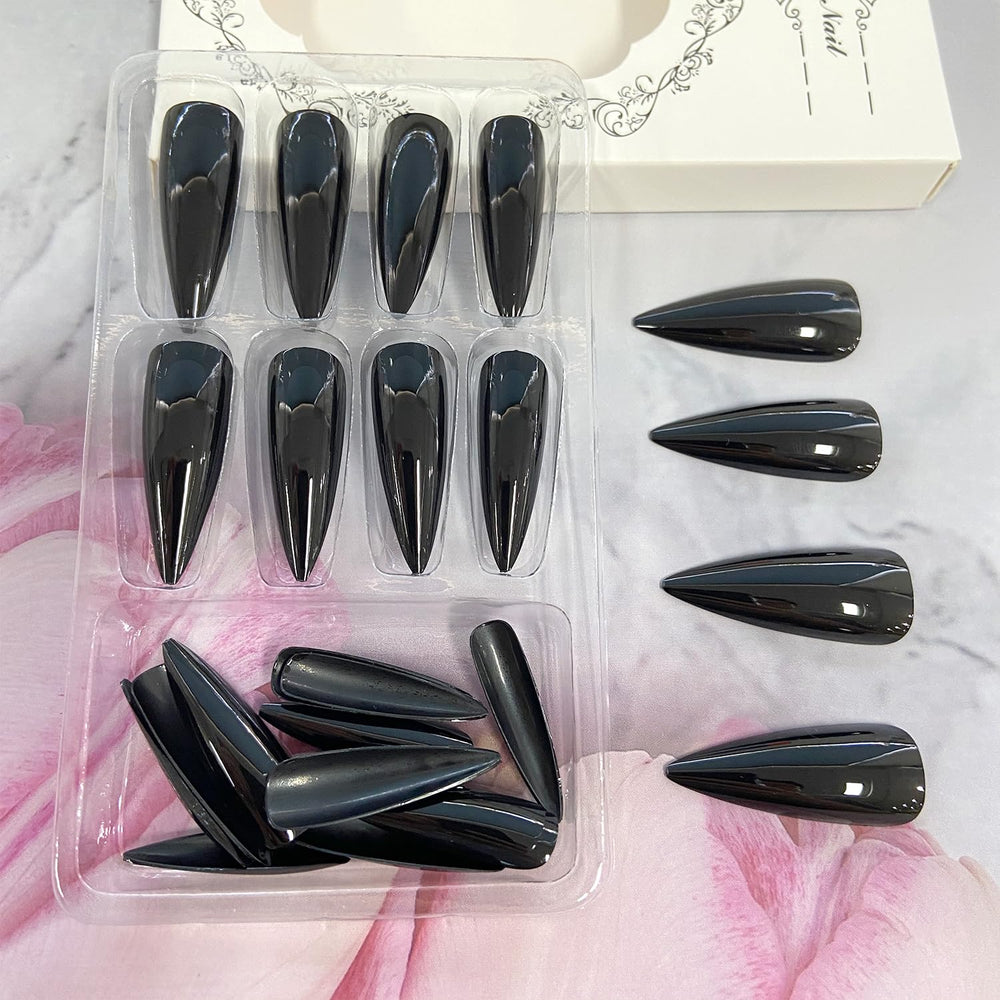 Black Solid Color Stiletto nails glossy finish close-up