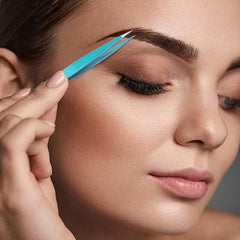 Blinkeen tweezers in use for eyebrow grooming and facial hair precision.