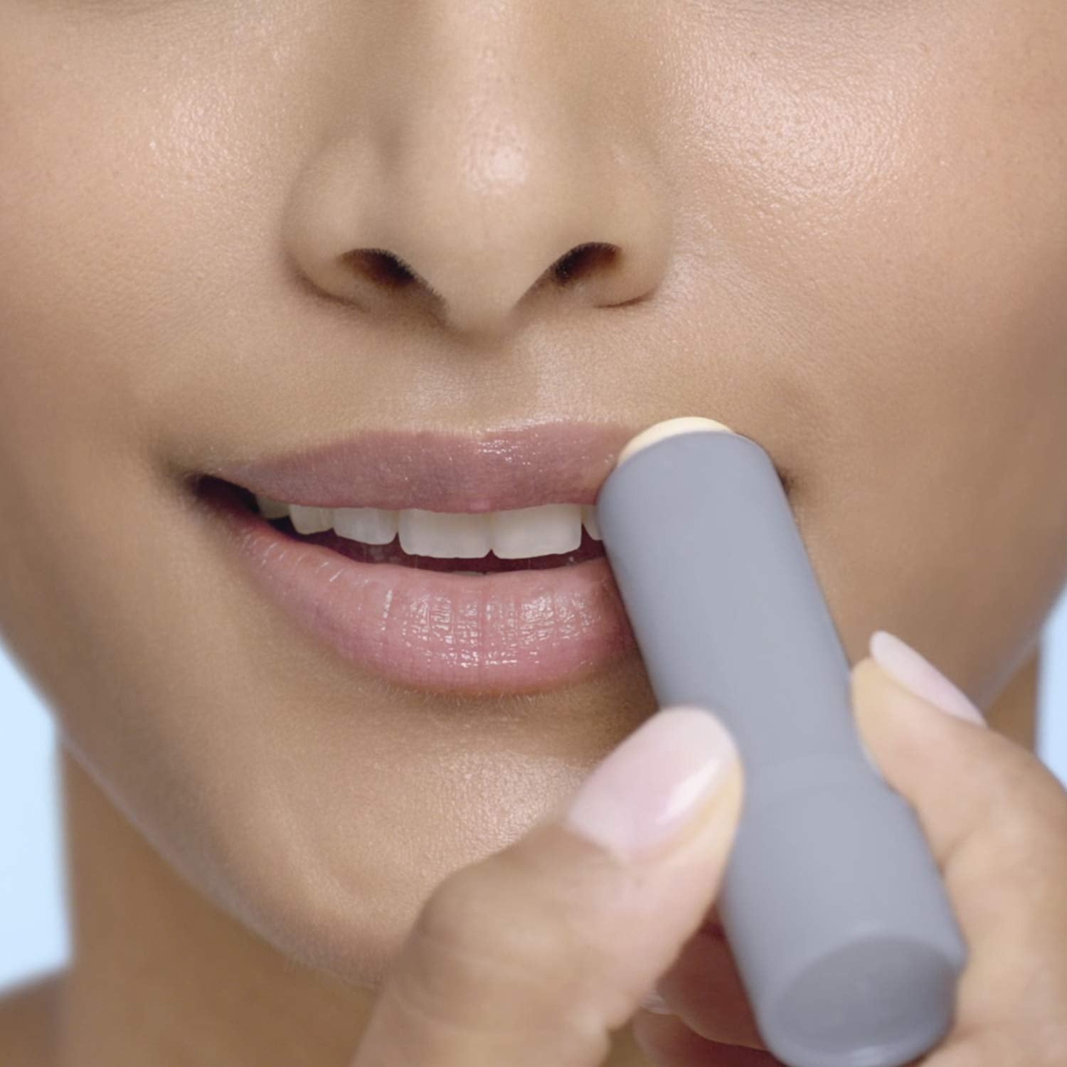 Blistex Silk & Shine open-tube application shows easy lip moisturization on the go.
