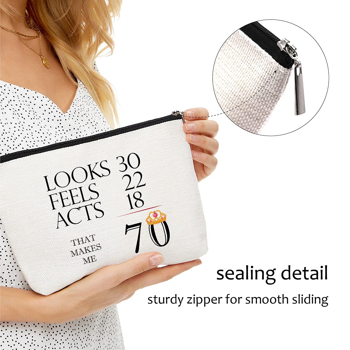 Blue Leaves 70th Unicorn makeup bag in hand shows its portable size.