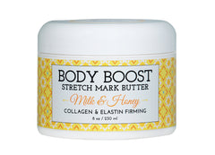 Body Boost Milk & Honey Stretch Mark Butter packaging close-up highlighting a nourishing formula for resilient skin.