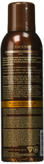 Body Drench Quick Tan spray in hand demonstrates easy, streak-free sunless tanning.