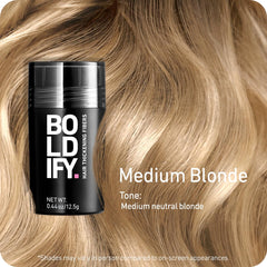 Boldify Hair Fibers being shaken over thinning crown area for natural-looking fullness.