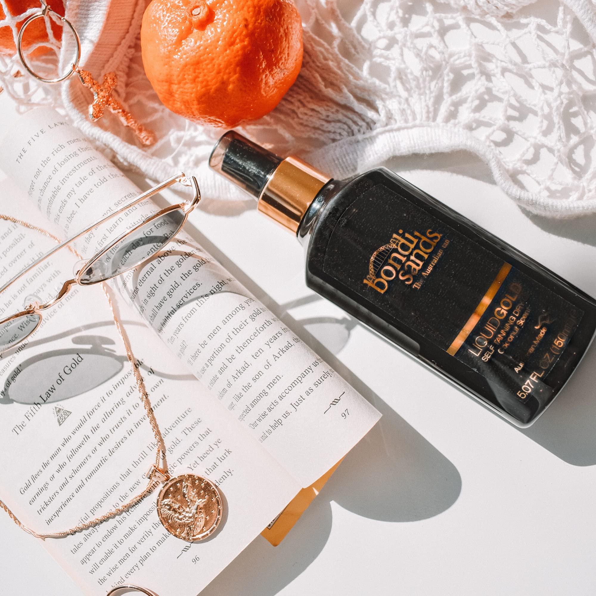 Bondi Sands Liquid Gold being massaged onto skin for even blend