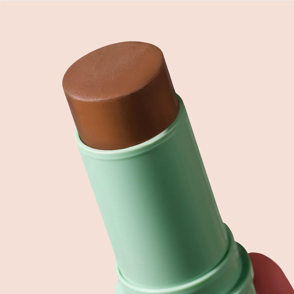 BOOM! BoomStick Bronze lip swipe creates cohesive color with soft glow.