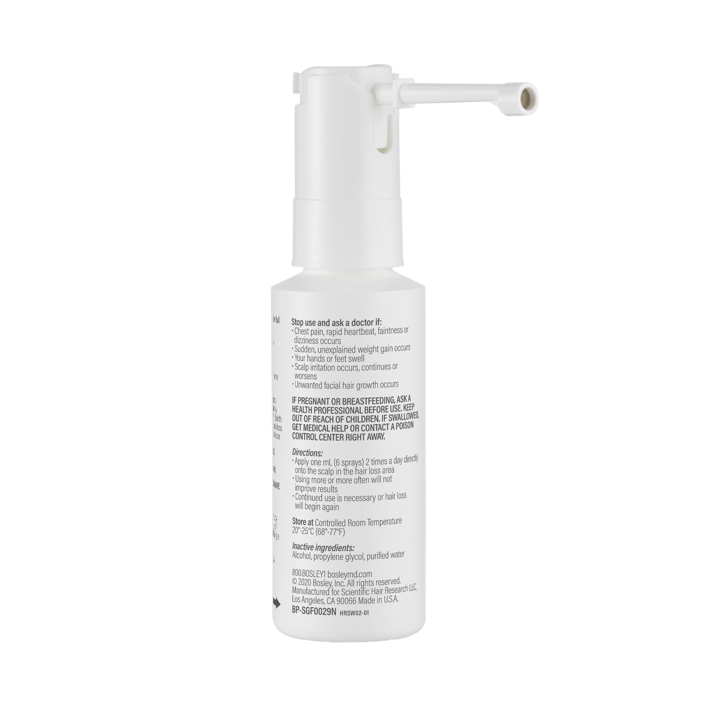 BosleyMD Minoxidil Woman Spray user in front of mirror ready to apply.