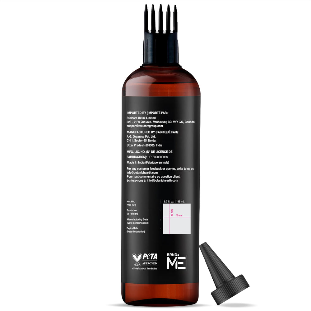Botanic Hearth Biotin Oil with apply comb showing even distribution for smooth strands