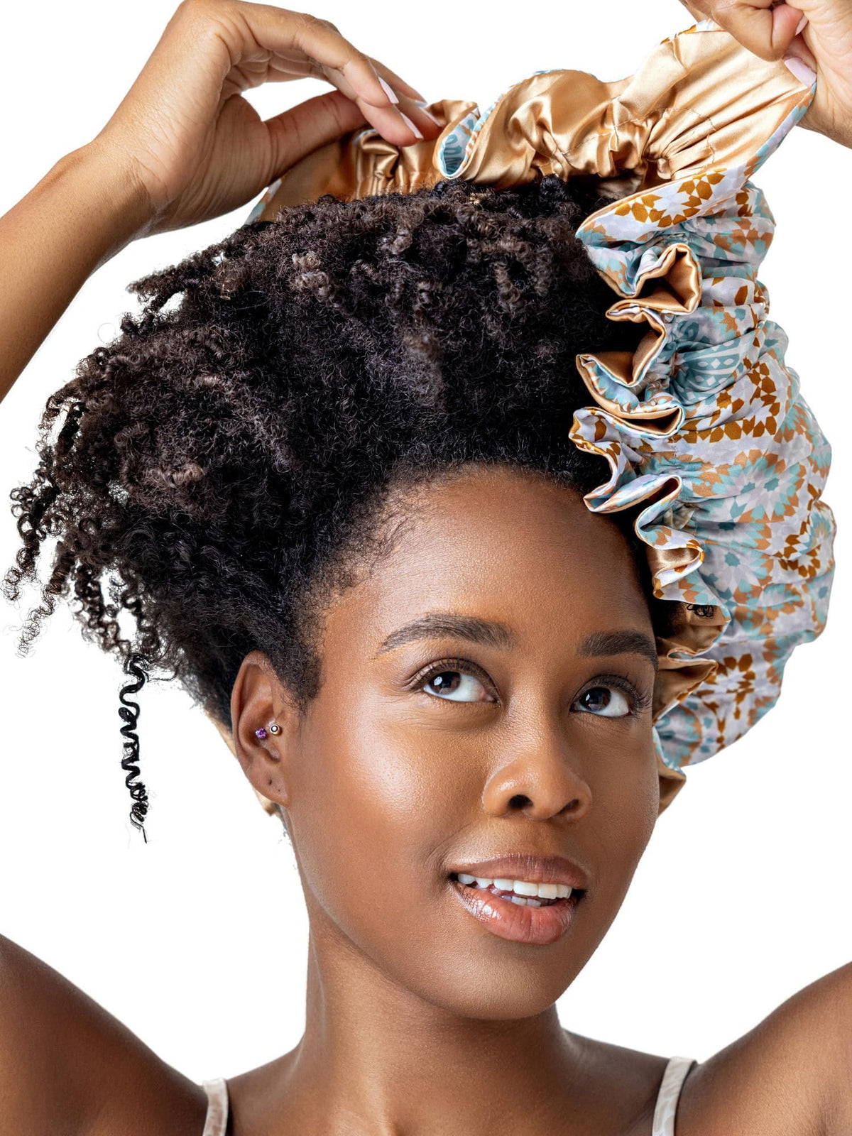 Bounce Curl reversible satin hair bonnet closeup highlights silky fabric for gentle overnight protection
