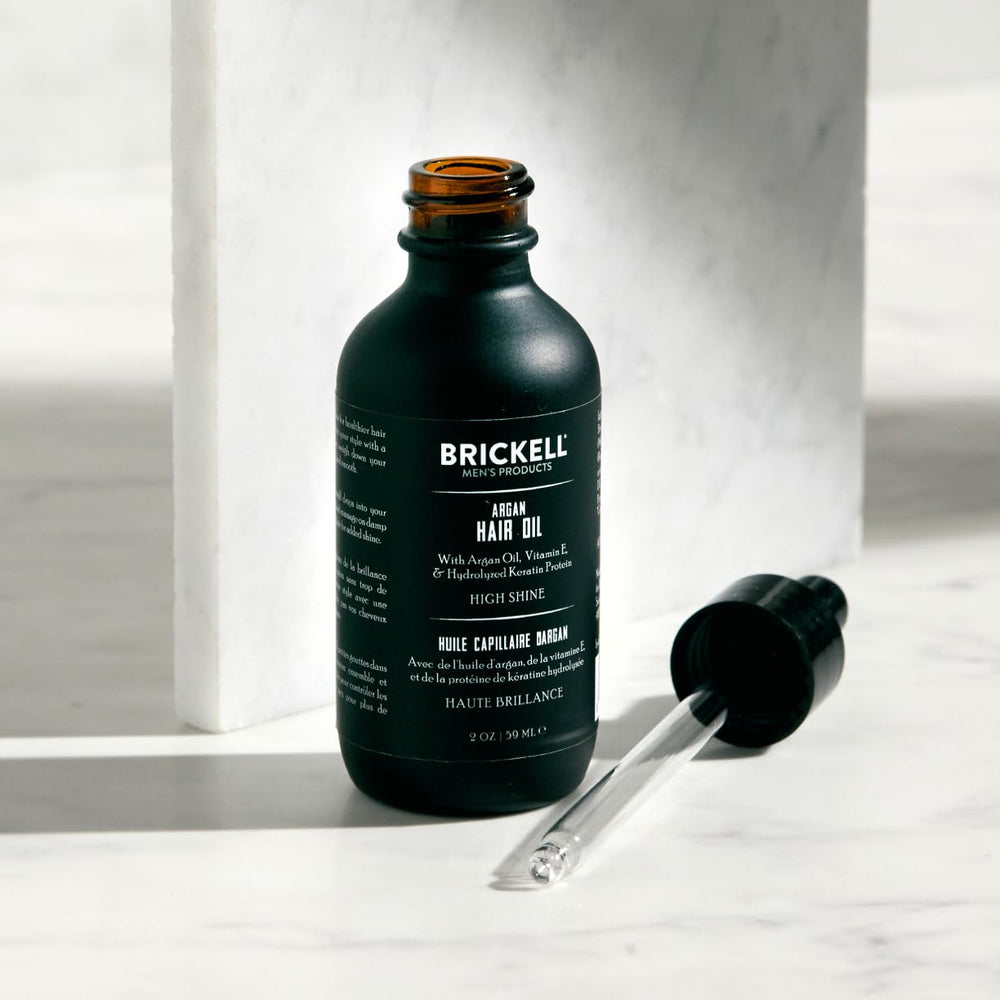 Brickell Men's Argan Oil being poured for lightweight daily use