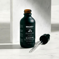 Brickell Men's Argan Oil being poured for lightweight daily use
