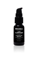 Brickell Men's Dark Circle Eye Serum bottle being applied to reduce under-eye puffiness.